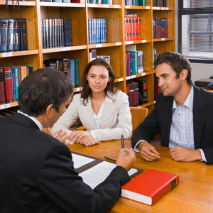 a man and a woman asking questions to a lawyer