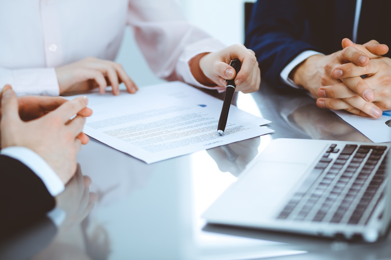 Clients discussing car injury case with lawyer