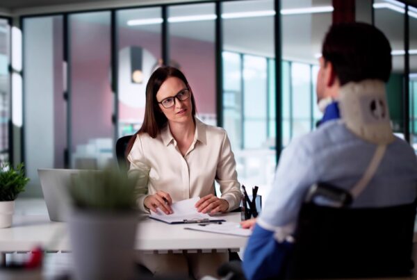 Personal injury client meeting with lawyer